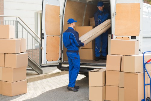 Removal team preparing furniture for a Boundsgreen home move