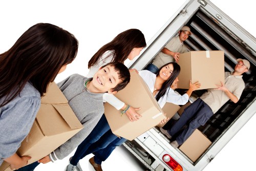 Local removals team planning a move in Boundsgreen street setting
