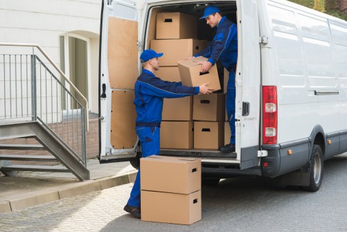 Man and van team loading items carefully in Bounds Green