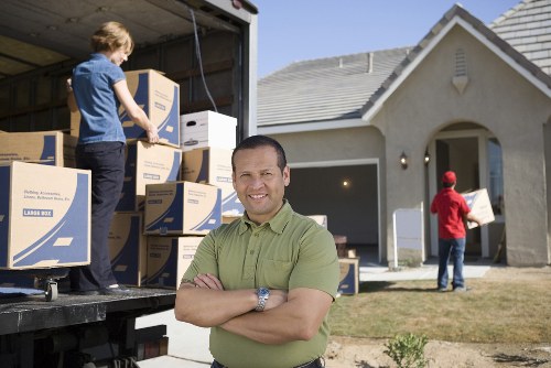 Furniture removal team handling bulky home furniture in Boundsgreen