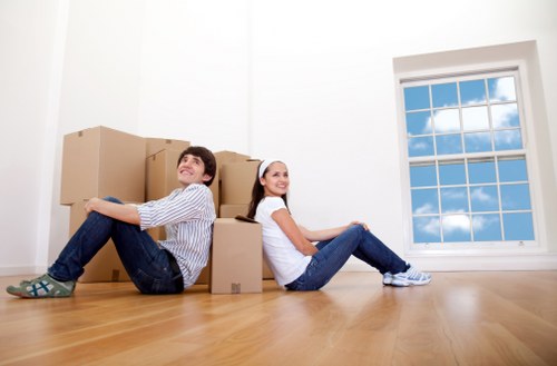 Packed boxes and furniture ready for van transport