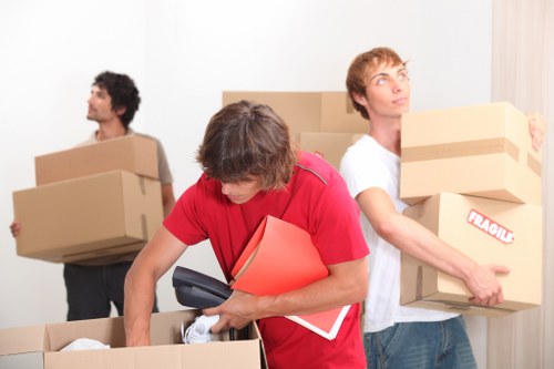 Driver reviewing a free quote for a Bounds Green moving job