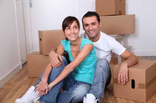 Packed household boxes and furniture ready for removals in Boundsgreen